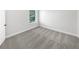 Bedroom features neutral walls, carpet, a window, and base-molding at 2910 Blake Towers Ln, Buford, GA 30519