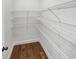 Walk in closet features wire shelving and hardwood floor at 2910 Blake Towers Ln, Buford, GA 30519