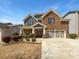 Charming two-story brick home with a well-maintained lawn and inviting front entrance at 2910 Blake Towers Ln, Buford, GA 30519