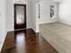 The front entryway has dark wood flooring, a decorative door and a view into the carpeted living room at 2910 Blake Towers Ln, Buford, GA 30519