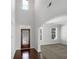 This is the entryway with dark wood flooring, a decorative front door and a view into the living space at 2910 Blake Towers Ln, Buford, GA 30519