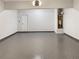 Clean and organized garage space with epoxy flooring, providing ample storage and utility connections at 2910 Blake Towers Ln, Buford, GA 30519