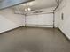 Spacious two-car garage with epoxy flooring, providing ample parking and storage space at 2910 Blake Towers Ln, Buford, GA 30519