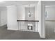 Upstairs hallway with decorative metal railing, natural light, and access to other rooms at 2910 Blake Towers Ln, Buford, GA 30519