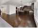 Open concept featuring a gourmet kitchen with an island, and hardwood floors next to the living room at 2910 Blake Towers Ln, Buford, GA 30519