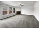 Spacious living area with large windows and a cozy fireplace, perfect for relaxation at 2910 Blake Towers Ln, Buford, GA 30519