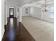 Elegant living room with hardwood entry, plush carpet, and a view of the decorative front door at 2910 Blake Towers Ln, Buford, GA 30519