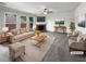 Bright and airy living room featuring a fireplace, ceiling fan, and neutral decor at 2910 Blake Towers Ln, Buford, GA 30519