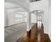 Spacious living room with gray carpet, chandelier, and natural light streaming through large windows at 2910 Blake Towers Ln, Buford, GA 30519