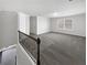 Second floor loft area with natural light and neutral carpet at 2910 Blake Towers Ln, Buford, GA 30519
