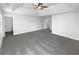 A bright and airy main bedroom with neutral walls, plush carpeting, and recessed lighting at 2910 Blake Towers Ln, Buford, GA 30519