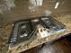 Granite countertop with built-in stovetop at 2910 Blake Towers Ln, Buford, GA 30519