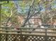 Inviting balcony view overlooking blooming trees and a charming brick building, perfect for relaxation at 475 Mount Vernon Ne Hwy # 226C, Atlanta, GA 30328
