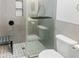 Bathroom with neutral tones and decorative shower tile, with sleek fixtures and convenient built-in bench at 475 Mount Vernon Ne Hwy # 226C, Atlanta, GA 30328