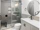 This modern bathroom features a glass shower door, black fixtures, and sleek vanity at 475 Mount Vernon Ne Hwy # 226C, Atlanta, GA 30328