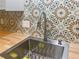Kitchen sink with a stainless steel faucet and decorative backsplash at 475 Mount Vernon Ne Hwy # 226C, Atlanta, GA 30328
