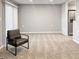 Living area with plush carpet, neutral paint, and sliding doors with vertical blinds at 475 Mount Vernon Ne Hwy # 226C, Atlanta, GA 30328