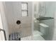 Modern bathroom with glass door shower, seat, and niche at 475 Mount Vernon Ne Hwy # 226C, Atlanta, GA 30328