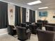 Movie theater room with comfortable seating and a large screen for residents' entertainment and viewing at 475 Mount Vernon Ne Hwy # 226C, Atlanta, GA 30328