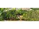 Aerial view showcases a home surrounded by lush trees near neighborhood amenities at 1791 Walker Sw Rd, Conyers, GA 30094