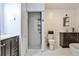Bright bathroom with white shiplap walls, marble floors, and a modern shower stall featuring subway tile at 1791 Walker Sw Rd, Conyers, GA 30094