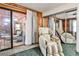 Bedroom with sliding glass doors to the back porch and comfy chair at 1791 Walker Sw Rd, Conyers, GA 30094
