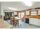 Bright kitchen with wooden counters, stainless steel appliances, and views into the dining room at 1791 Walker Sw Rd, Conyers, GA 30094