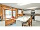 Bright kitchen with white cabinets, a marble island, and stainless steel appliances at 1791 Walker Sw Rd, Conyers, GA 30094