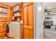 Laundry room with washer, dryer, shelves, and access to the living area at 1791 Walker Sw Rd, Conyers, GA 30094