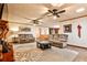 Cozy living room with plush sofas, a decorative rug, a coffee table, and a ceiling fan at 1791 Walker Sw Rd, Conyers, GA 30094