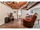 Finished basement living room with wood-look floors and comfortable seating at 1791 Walker Sw Rd, Conyers, GA 30094