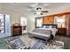 Bedroom with wood walls, and a door to the bathroom at 1791 Walker Sw Rd, Conyers, GA 30094