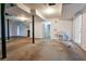 Unfinished basement area with exposed utilities, concrete floor, and walk-out access at 1810 Talbot Ct, Lawrenceville, GA 30044