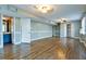 Finished basement with wood-look floors, blue accent wall, and full bathroom at 1810 Talbot Ct, Lawrenceville, GA 30044