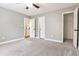Bedroom with light gray walls, carpet flooring, ceiling fan, and closet at 1810 Talbot Ct, Lawrenceville, GA 30044