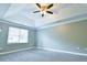 Bedroom with large window, fan and neutral paint at 1810 Talbot Ct, Lawrenceville, GA 30044