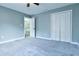 Bedroom with gray walls, carpet flooring, closet, and white trim at 1810 Talbot Ct, Lawrenceville, GA 30044