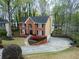 Two-story brick home boasts a spacious driveway and manicured front lawn at 1810 Talbot Ct, Lawrenceville, GA 30044