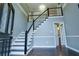 Inviting foyer showcasing staircase and hardwood floors, complemented by natural light at 1810 Talbot Ct, Lawrenceville, GA 30044