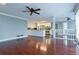 Spacious living area with hardwood flooring leading to kitchen with modern appliances at 1810 Talbot Ct, Lawrenceville, GA 30044