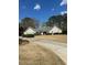 Charming single-story home with manicured lawn, driveway, and mature trees offering great curb appeal at 595 Willow Knoll Se Dr, Marietta, GA 30067
