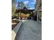Stone patio with a pergola, swing, chairs, and outdoor furniture perfect for outdoor entertaining at 595 Willow Knoll Se Dr, Marietta, GA 30067