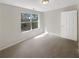 Inviting bedroom featuring a light-filled space with a door and a window overlooking the outdoors at 7302 Par Four Way, Lithonia, GA 30038