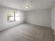 Bright and airy bedroom with ample space and natural light, offering a peaceful retreat for relaxation and rest at 7302 Par Four Way, Lithonia, GA 30038