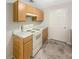Efficient kitchen with wooden cabinets and modern appliances, providing a practical space for cooking and meal preparation at 7302 Par Four Way, Lithonia, GA 30038