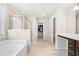 Modern bathroom featuring a separate tub, shower, and walk-in closet at 485 Auburn Crossing Dr, Auburn, GA 30011