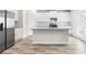 Modern kitchen featuring stainless steel appliances, granite countertops, and a functional island at 485 Auburn Crossing Dr, Auburn, GA 30011