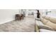 Open-concept living area with a dining space, a kitchen and a comfortable sofa at 485 Auburn Crossing Dr, Auburn, GA 30011