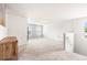 The open loft area features neutral carpet, natural light, and is ready for your personal touch at 485 Auburn Crossing Dr, Auburn, GA 30011