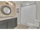 Well-lit bathroom features updated vanity, a neutral color palette, and a shower and tub combo at 1025 Saint Marks Walk, Suwanee, GA 30024